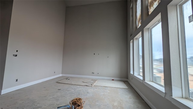 401 Wild Thicket Dr, Katy, TX 77493 - unfurnished room featuring healthy amount of natural light and concrete flooring
