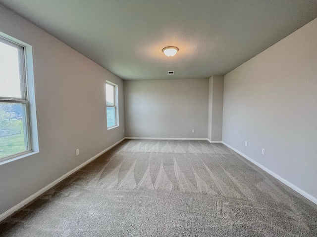 306 N Orange St, Sweeny, TX 77480 - empty room featuring carpet floors and baseboards