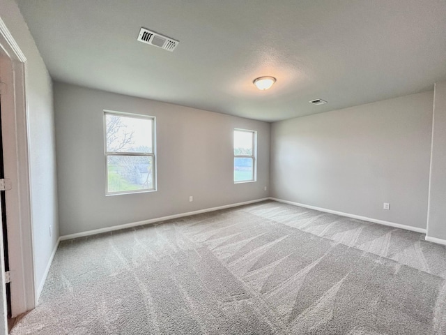 306 N Orange St, Sweeny, TX 77480 - spare room featuring carpet flooring and baseboards