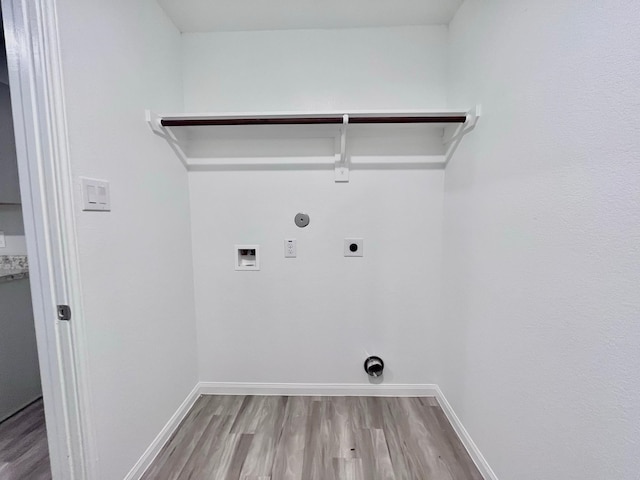 306 N Orange St, Sweeny, TX 77480 - laundry room with electric dryer hookup, washer hookup, wood finished floors, baseboards, and hookup for a gas dryer