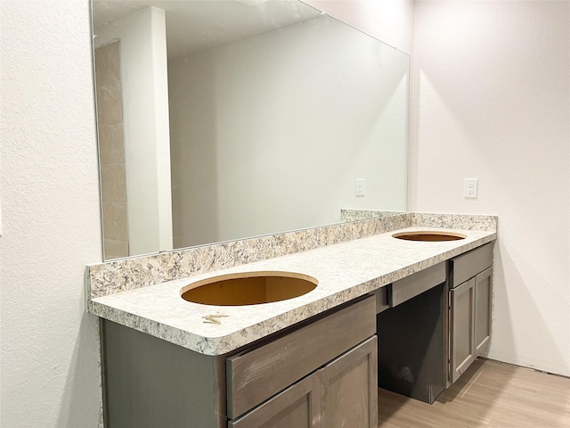 306 N Orange St, Sweeny, TX 77480 - full bath featuring wood finished floors and double vanity