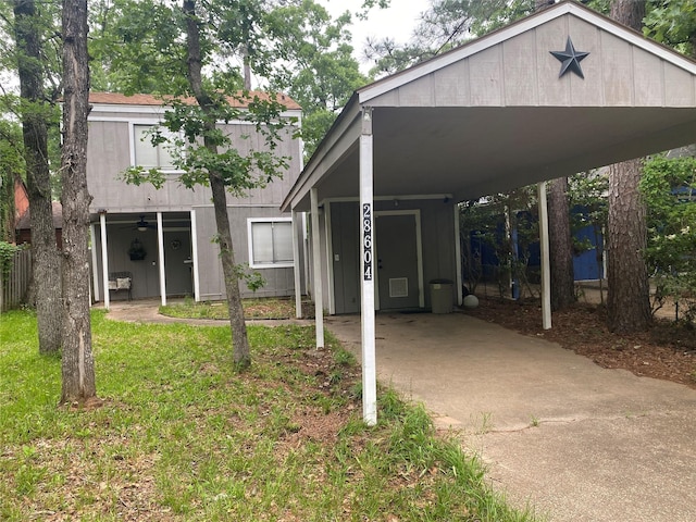 28604 Magnolia Ct, Huntsville, TX 77320 - view of front of home with a carport and a front yard