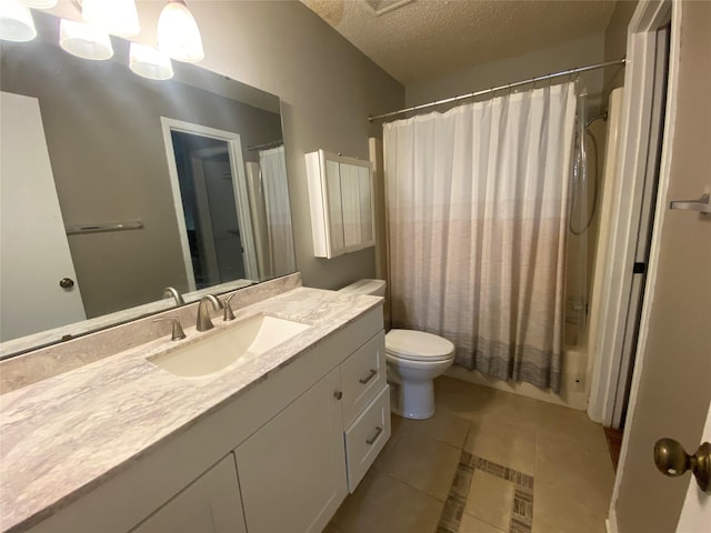 28604 Magnolia Ct, Huntsville, TX 77320 - bathroom with tile patterned flooring, shower / bath combination with curtain, toilet, vanity, and a textured ceiling