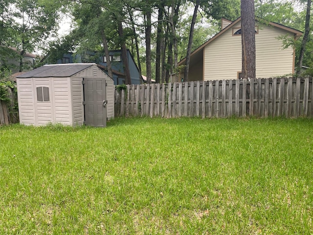 28604 Magnolia Ct, Huntsville, TX 77320 - view of yard featuring a storage shed, fence, and an outdoor structure