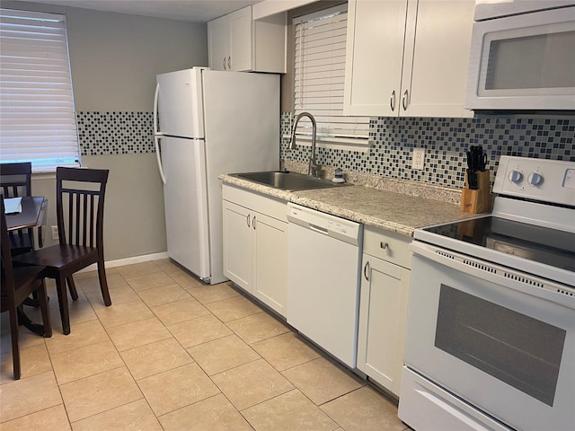 28604 Magnolia Ct, Huntsville, TX 77320 - kitchen with white appliances, a sink, backsplash, and light tile patterned floors