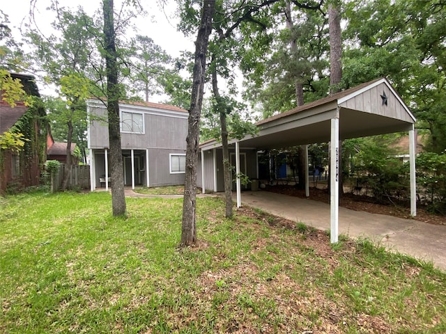 28604 Magnolia Ct, Huntsville, TX 77320 - view of yard featuring a carport