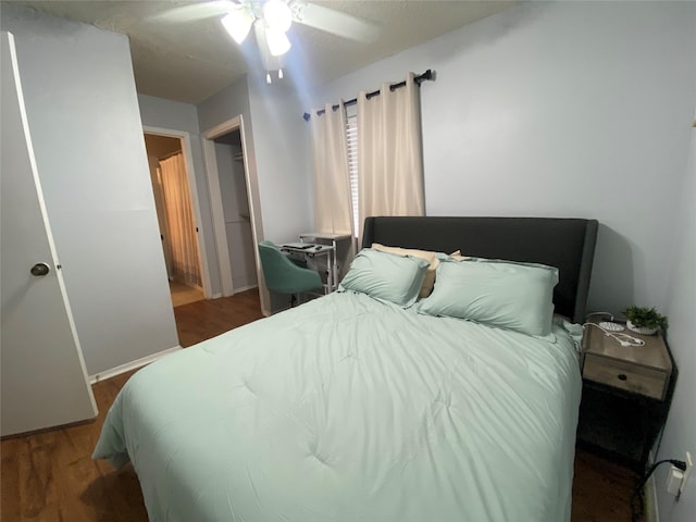28604 Magnolia Ct, Huntsville, TX 77320 - bedroom featuring wood finished floors, baseboards, and ceiling fan