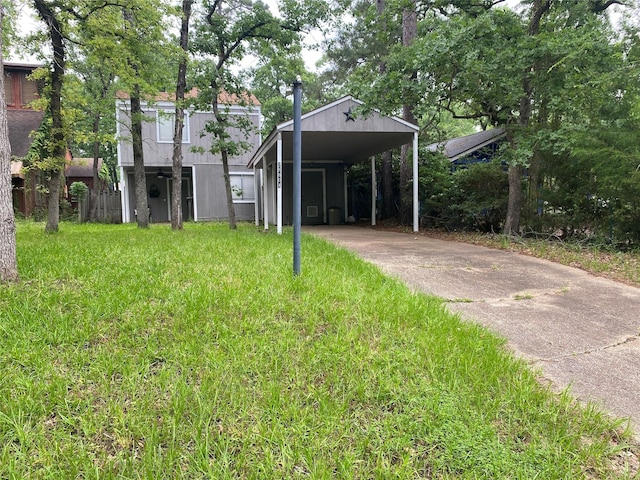 28604 Magnolia Ct, Huntsville, TX 77320 - exterior space featuring driveway and a detached carport