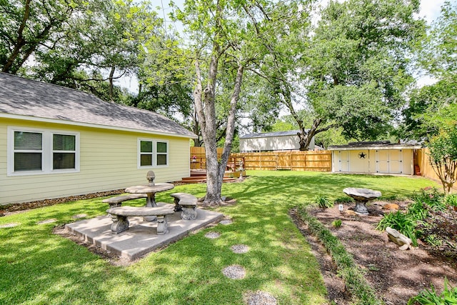 3339 Terry St, Needville, TX 77461 - view of yard with a storage shed, an outbuilding, and a fenced backyard