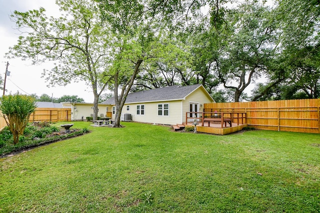 3339 Terry St, Needville, TX 77461 - rear view of property with a lawn, a wooden deck, a fenced backyard, and central air condition unit