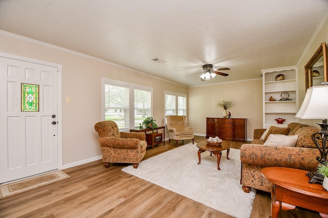 3339 Terry St, Needville, TX 77461 - living area with visible vents, ornamental molding, light wood-style flooring, and baseboards