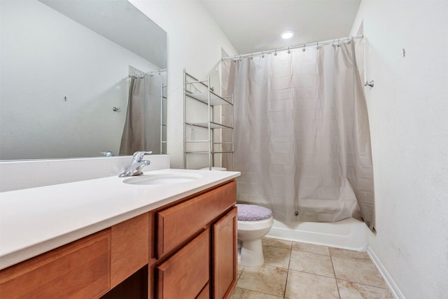 full bath with toilet, tile patterned floors, and vanity