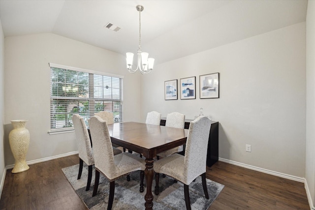 dining space with lofted ceiling, dark wood-style floors, an inviting chandelier, visible vents, and baseboards
