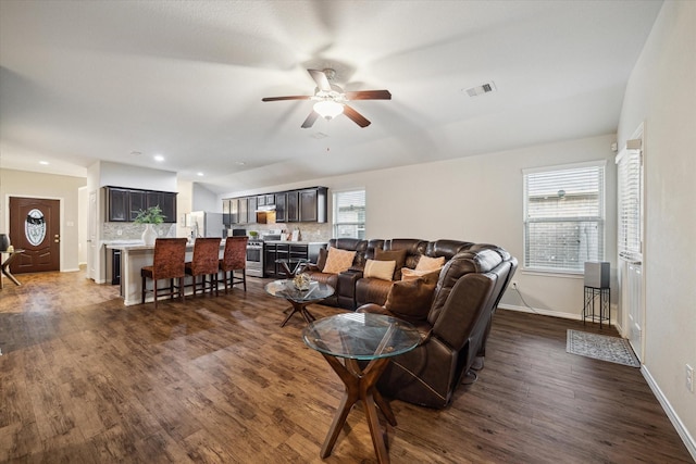 living area with baseboards, visible vents, recessed lighting, a ceiling fan, and dark wood-type flooring
