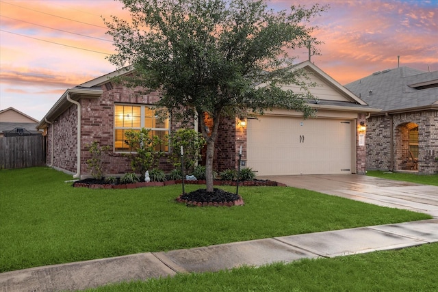 view of front of home featuring concrete driveway, an attached garage, brick siding, and a front yard