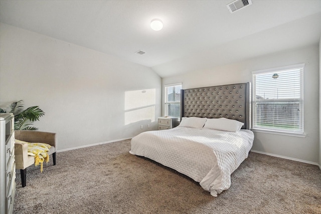 carpeted bedroom featuring vaulted ceiling, visible vents, and baseboards