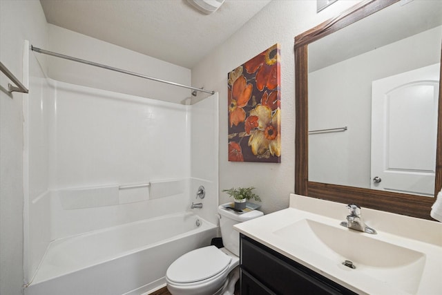 bathroom with vanity, tub / shower combination, and toilet
