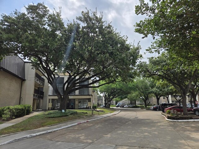 3005 Walnut Bend Ln Unit 32, Houston, TX 77042 - view of concrete road with curbs and sidewalks