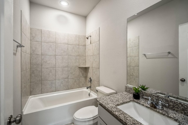 bathroom featuring vanity,  shower combination, and toilet