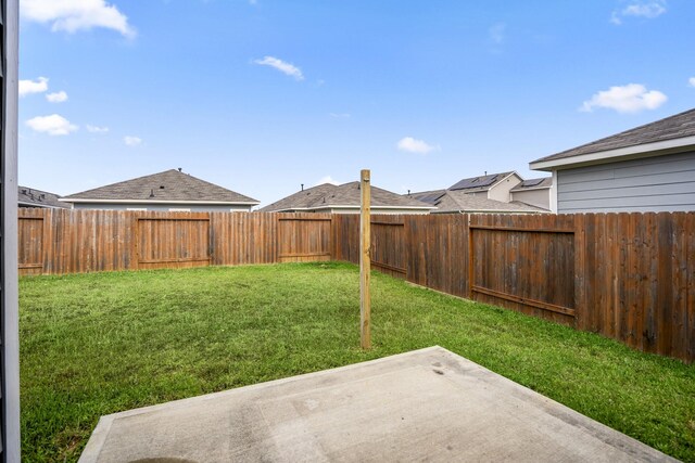 view of yard with a patio area and a fenced backyard