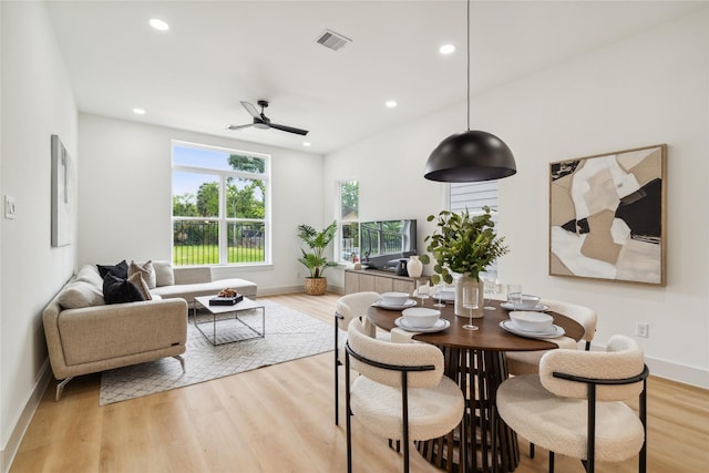 dining area featuring light wood-style flooring, baseboards, visible vents, recessed lighting, and ceiling fan