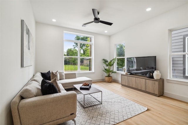 living area featuring ceiling fan, light wood-style floors, and recessed lighting