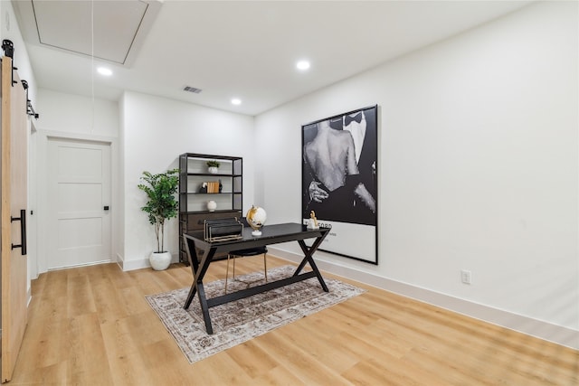 office featuring attic access, light wood-style floors, baseboards, visible vents, and recessed lighting