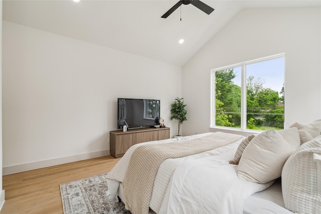 bedroom featuring baseboards, recessed lighting, light wood-style floors, ceiling fan, and high vaulted ceiling