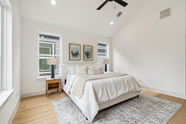 bedroom featuring multiple windows, visible vents, and light wood-style flooring