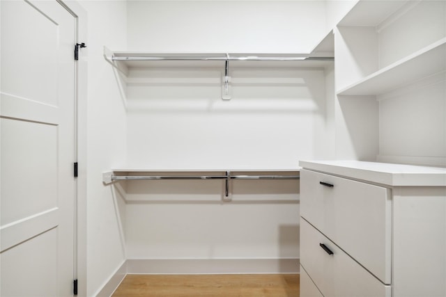 spacious closet with light wood-style flooring