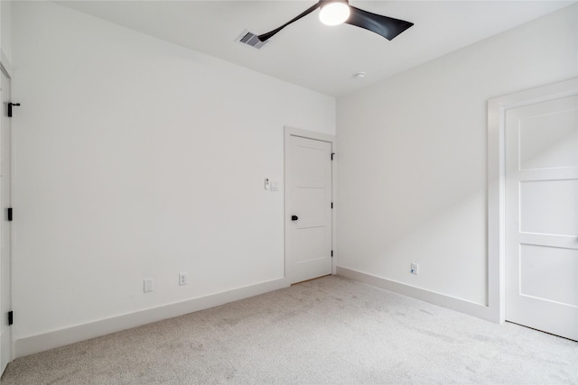 unfurnished bedroom featuring ceiling fan, carpet floors, visible vents, and baseboards