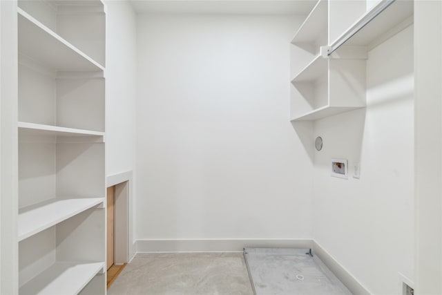 laundry area featuring hookup for a washing machine, baseboards, and laundry area