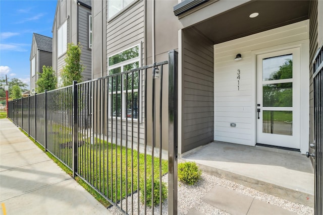 property entrance with fence