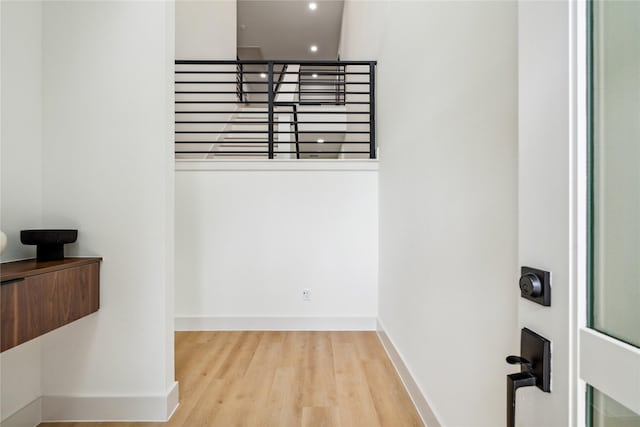 interior space featuring recessed lighting, wood finished floors, and baseboards