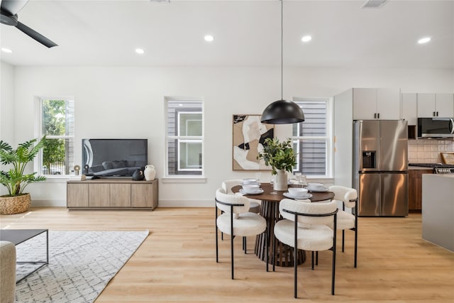 dining area with a ceiling fan, light wood-style flooring, baseboards, visible vents, and recessed lighting