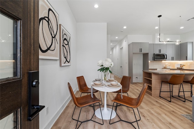 6412 Foster St, Houston, TX 77021 - dining space with recessed lighting, light wood-style floors, visible vents, and baseboards