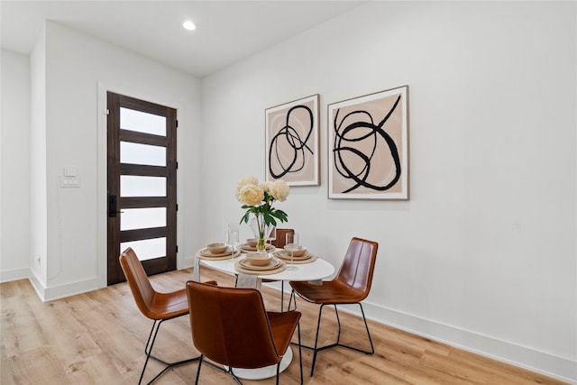 6412 Foster St, Houston, TX 77021 - dining room featuring light wood-type flooring, a wealth of natural light, and baseboards