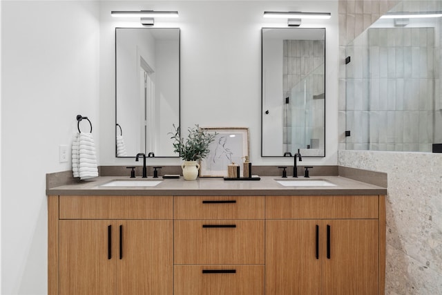 6412 Foster St, Houston, TX 77021 - bathroom featuring a tile shower, double vanity, and a sink