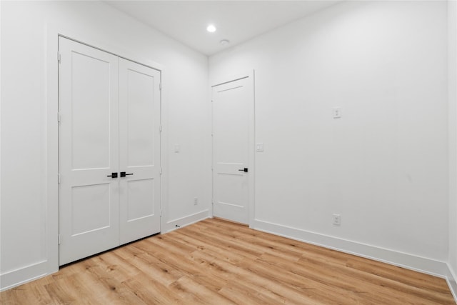 6412 Foster St, Houston, TX 77021 - unfurnished bedroom featuring recessed lighting, a closet, light wood finished floors, and baseboards