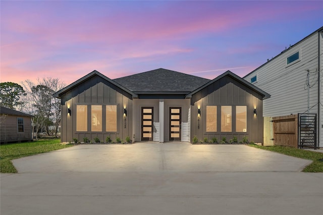 6412 Foster St, Houston, TX 77021 - view of front of home featuring concrete driveway, a shingled roof, board and batten siding, and fence