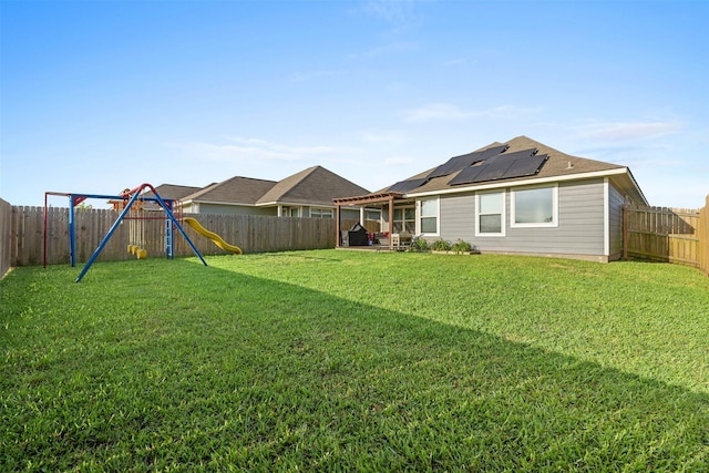 125 Dove Landing Ct, Navasota, TX 77868 - view of yard featuring a patio area, a fenced backyard, and a playground