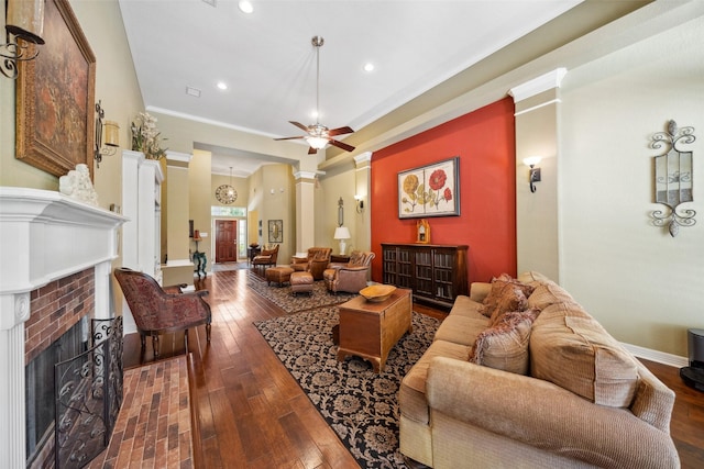 236 Camden Hills Dr, Montgomery, TX 77356 - living area with a fireplace, dark wood-style floors, ceiling fan, recessed lighting, and ornamental molding