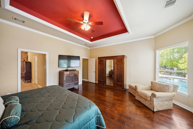 236 Camden Hills Dr, Montgomery, TX 77356 - bedroom featuring a raised ceiling, hardwood / wood-style flooring, crown molding, and a ceiling fan