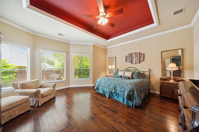 236 Camden Hills Dr, Montgomery, TX 77356 - bedroom featuring a tray ceiling, dark wood finished floors, ceiling fan, and crown molding