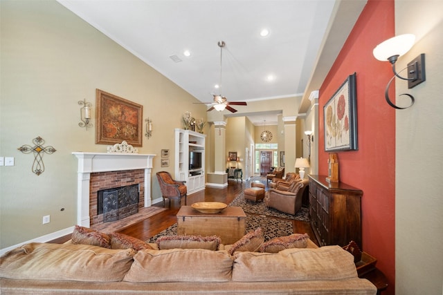 236 Camden Hills Dr, Montgomery, TX 77356 - living area with a brick fireplace, wood finished floors, a ceiling fan, ornamental molding, and recessed lighting