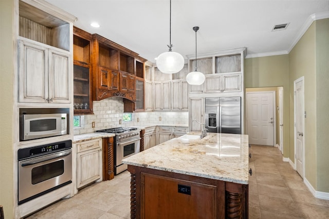 236 Camden Hills Dr, Montgomery, TX 77356 - kitchen featuring appliances with stainless steel finishes, backsplash, ornamental molding, light stone countertops, and decorative light fixtures