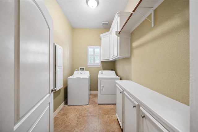 236 Camden Hills Dr, Montgomery, TX 77356 - washroom with separate washer and dryer, cabinet space, and light tile patterned flooring