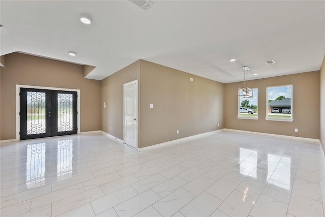 unfurnished room with recessed lighting, visible vents, baseboards, and french doors