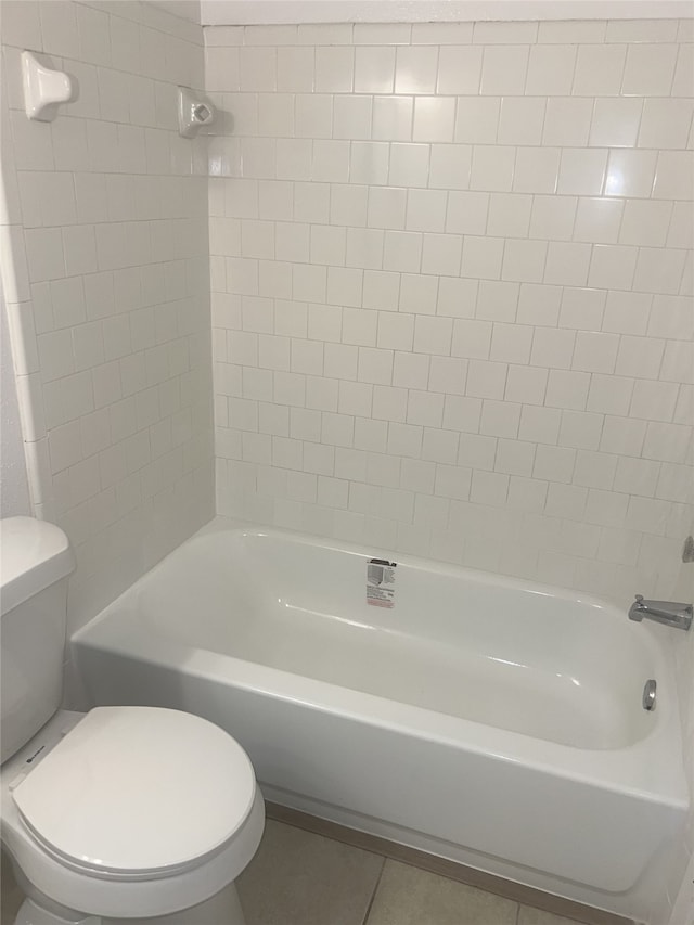 2711 N Belgravia Dr, Pearland, TX 77584 - bathroom with tile patterned floors, bathing tub / shower combination, and toilet