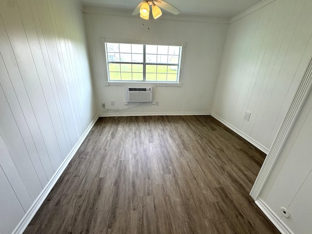 unfurnished room featuring a ceiling fan, a wall unit AC, ornamental molding, dark wood-type flooring, and baseboards